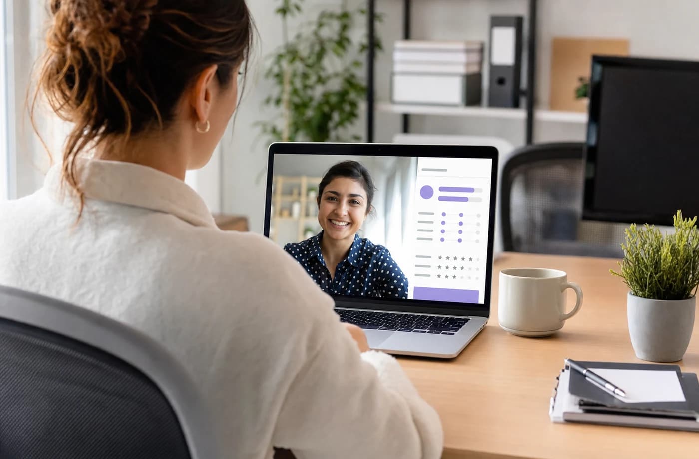 Recruiter conducting a structured remote interview on a laptop